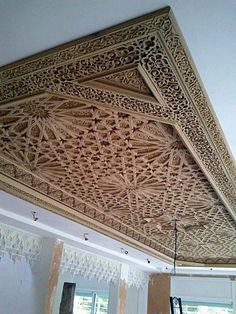 an intricately carved wooden ceiling in a home