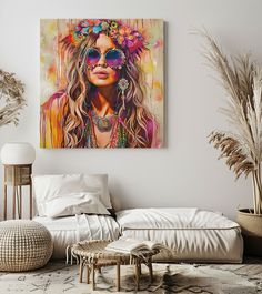 a living room filled with furniture and art on the wall above it is a painting of a woman's face