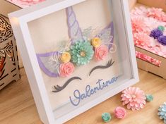 there is a card with flowers on it and the words galaetina written in blue