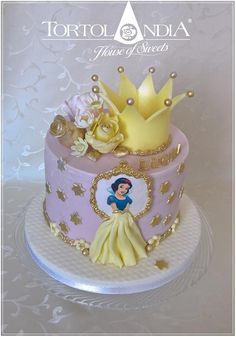 there is a cake decorated with princesses and flowers