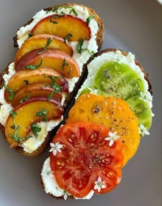 an open face sandwich with tomatoes, avocado and other toppings on it