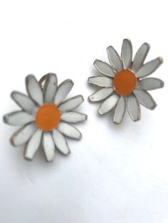 Classic Daisy Earrings, 60s Flower Power, Vintage Clip ons for any Ear, Trending Preppy Cottage Fashion  Enamel paint on Goldtone -  1 inch collected vintage with some light wear,firm clips  Arrives  polished &  gift nicely 🎀 www.fivebunniesbyMoxie.com  an Etsy shoppe 🌿 Curated by moxie🐰 & mommy🌸 www.MySoulRepair.com  www.MySoulRepair.NYC  glamour jewelry & gifts Vintage Flower Earrings For Spring, Handmade Vintage White Clip-on Earrings, Vintage Yellow Earrings For Summer, Vintage Yellow Summer Earrings, Vintage Enamel Flower Earrings, Retro Flower-shaped Jewelry For Summer, Retro White Flower Jewelry, Handmade Vintage Earrings For Spring, Vintage White Summer Jewelry