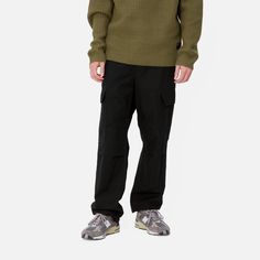 Color: Black - The Regular Cargo Pant is made of midweight cotton Columbia ripstop, which has been rinsed for a softer feel. The style is cut in a regular fit with a low waist and features double-layer knees, adding to its robust qualities. Multiple pockets throughout nod to the garment's military-style influences, and tie detailing at the cuffs allow for the fit to be adjusted. The Aviation Pant () offers the same lightweight quality construction with a slimmer fit. _* Columbia ripstop: 100% co Work Coat, Basic Shorts, Jacket Parka, Cargo Pant, Loose Pants, Military Style, Carhartt Wip, Long Sleeve Polo, Jacket Sale