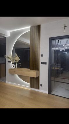 a living room filled with furniture and a large mirror on the wall next to it