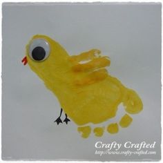 a drawing of a yellow bird with big eyes on it's face and feet