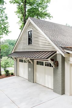 an instagramted photo of a house with two garages