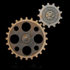 two gears are shown on a black background