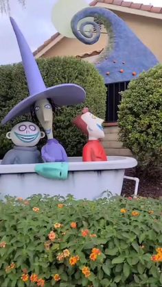 two cartoon figures are sitting in a tub with flowers around them and one has a hat on his head