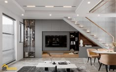 a modern living room with stairs leading up to the second floor and an entertainment center