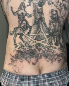 the back of a man with tattoos on his body