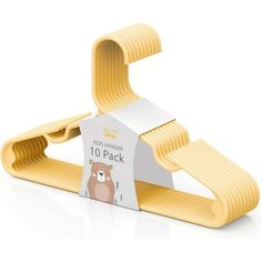 a yellow paper holder with a brown bear on the front and white label attached to it