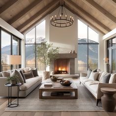 a living room filled with furniture and a fire place in the middle of a room