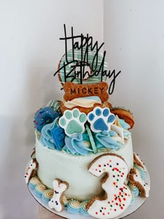 a birthday cake with frosting and decorations