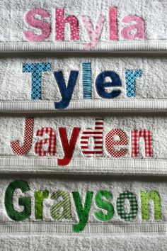 three towels with the names of four different countries on them, all hand sewn together