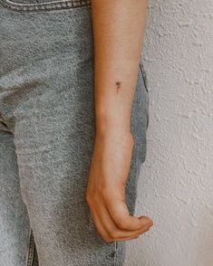 a person with a small tattoo on their arm