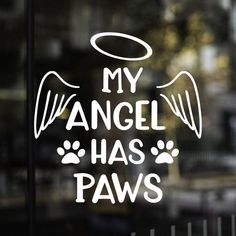 an angel has paws decal on the window