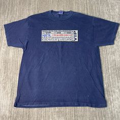 a blue t - shirt with the word's name on it