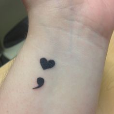 small black hearts tattoo on the wrist