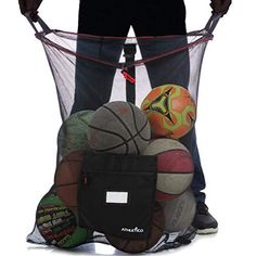 a man standing behind a net filled with basketballs and other sports balls in it