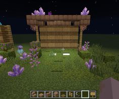 a screenshot of a purple flower garden in minecraft