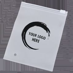 a white bag with a black circle on the front that says, your logo here