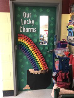 the door to our lucky charms store is decorated with shamrocks and rainbows on it