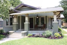 the front porch of a house with steps leading up to it