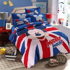 a mickey mouse bed in a bedroom with blue walls