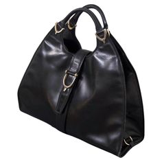 Gucci Vintage Black Leather Stirrup Hobo Handbag | From a unique collection of rare vintage Hobo Bags at https://www.1stdibs.com/fashion/handbags-purses-bags/shoulder-bags/hobo-bags/. Trapezoid Shape, Leather Bag Design, Gucci Vintage, Black Leather Bag, Hobo Handbag, Italian Craftsmanship, Handbags And Purses, Stirrups, Black Leather Bags