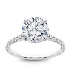 a diamond engagement ring on a white background