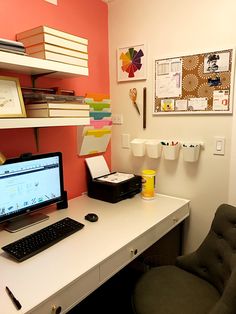 a desk with a computer and printer on it