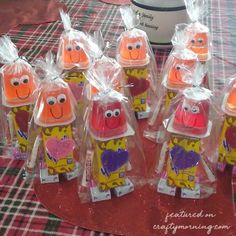 some plastic bags filled with cartoon characters on top of a table