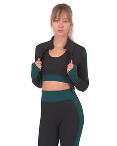 The high-collared zip-up Trois Seamless Sports Jacket is unique within our collection as it features two different fabric designs! The colorful black and blue striped design alternates with pure black ruched/stippled fabric areas, which gives this crop-top jacket style and sophistication combined with practicality of the highest level.Its unique and chic style makes the Trois jacket an amazing addition to your workout wardrobe. Pair it up with the Trois Black/Blue Legging and Sports Bra set to make the stunning Trois 3 Set! You'll be the standout at the gym! (Leggings and sports bra pictured here but sold separately).Our model is wearing size medium.Composition & Care: Fabric composition: 10% Spandex; 60% Nylon & 30% Polyester Made in China Model is wearing a size medium Hand wash normal D Womens Activewear Tops, Crop Top Jacket, Sports Bra Set, Pure Black, Fabric Designs, Leggings Sale, Blue Leggings, Gym Leggings, Active Wear Outfits