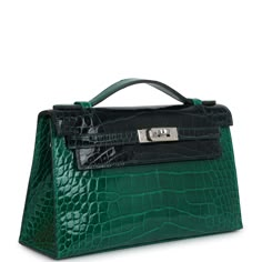 This Kelly Bi-color Pochette is in Vert Emeraude and Vert Rousseau shiny Alligator Mississippiensis leather with palladium hardware, tonal stitching, front flap with two straps, toggle closure and single flat handle.The Interior is lined in Vert Emeraude lambskin leather and has an open wall pocket.Collection: BOrigin: FranceCondition: New and never worn (plastic on hardware)Accompanied by: Hermes box, Hermes dustbag, felt, copy of CITESMeasurements: 8.5" width x 5" height x 2.5" depth; 1" top h Vert Criquet Hermes, Hermes Birkin Green, Hermes Vert Cypress, Emerald Green Hermes Bag, Luxury Green Bags With Turn-lock Closure, Hermes Kelly 25, Cute Luggage, Hermes Kelly Bag, My Style Bags