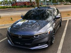 a gray car parked in a parking lot