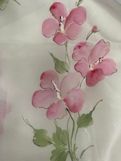 pink flowers on white fabric with green leaves and stems in the center, as if it were painted by watercolors