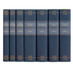 six blue books are lined up against each other