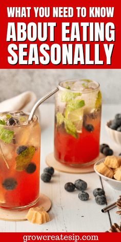 two glasses filled with blueberries and lemonade on top of a table