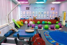 a child's play area with toys on the floor and children's gym equipment