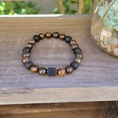 "This beautiful Bronzite & Lava Stone Bracelet is a powerful combination of stones that offer both protection and grounding. The Bronzite stone repels negative energies, promoting a state of certainty and adaptability. It clears confusion and enhances decision-making abilities, making it easier to navigate life's direction. Bronzite is also known as the \"stone of courtesy,\" promoting politeness in interactions with others. Emotionally, it encourages open-mindedness, empathy, and resolves linge Open Mindedness, Lava Stone Bracelet, Protection Bracelet, Rose Jewelry, Navigating Life, Lava Stone, Handmade Design, Decision Making, Stone Bracelet