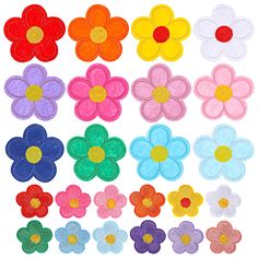 colorful felt flowers are shown in different colors