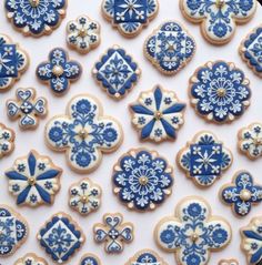 blue and white decorated cookies on a plate