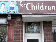 a sign on the side of a building that says for children