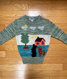 "Darling 1970s pastel space dye pullover sweater featuring an adorable front scene made of both woven intarsia elements and dimensional, terrycloth add-ons -- the latter include a spotted deer, country home, dirt lane, chimney smoke, sun, tree, etc.  The space dye sweater part is made from pastel yarns in blue, green, pink and yellow. The intarsia clouds and water are woven into the sweater fabric.    The darling OOAK terrycloth & intarsia country scene is in unusual, pretty colors -- like the s Pastel Space, Spotted Deer, Black Deer, Novelty Sweater, Sweater Fabric, Country Scenes, Pretty Colors, Pullover Sweater Women, Country Home