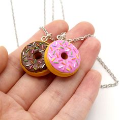 These kawaii necklaces feature cute donut pendants in small charm size. Choose from classic chocolate frosted or strawberry frosted with sprinkles!I designed each of these doughnut pendants. Each one measures about 3/4" long. Choose your favorite pink frosted raised donut with rainbow sprinkles or raised chocolate frosted donut with rainbow sprinkles. Comes on your choice of 18" gold or hypoallergenic non tarnish stainless steel chain. **Made to Order- Please allow 2 weeks from time of purchase Pink Doughnut, Pink Doughnuts, Rainbow Donut, Donut Necklace, Rainbow Sprinkle, Clay Candy, Kawaii Necklace, Food Necklace, Sprinkle Donut