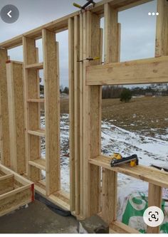 the inside of a house being built with wood framing and tools on top of it