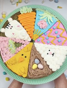 a person holding a plate with different types of food on it's side,