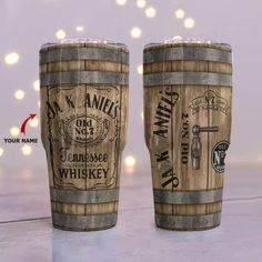 two wooden barrels sitting next to each other