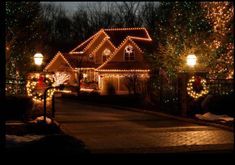 a house covered in christmas lights at night