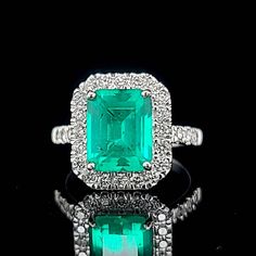 Gorgeous 14K white gold emerald engagement ring. center  lab grown emerald in rectangular shape. weight 3.10ct. size 10x8mm  nice vivid green colombia color,clean, very lively ,nice cut,side set natural rounds diamonds total weight 0.75ct H-SI1  Ring SIZE 7 Resizable  Retail value $6,500 net.  Cert Appraisal available Green Diamond Ring With Vvs Clarity And Radiant Cut, Luxury Square Cut Green Emerald Ring, Square Cut Green Diamond Ring In Fine Jewelry Style, Rectangular Green Emerald Diamond Ring, Green Square Cut Diamond Ring Fine Jewelry, Green Emerald Cut Ring With Halo Setting, Green Emerald Cut Diamond Ring, Fine Jewelry Green Diamond Ring With Square Cut, Formal Green Rectangular Diamond Ring